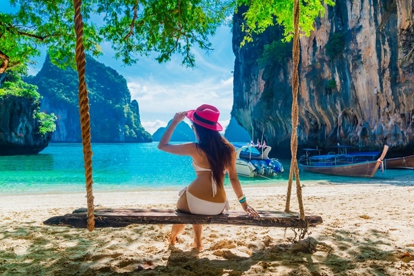 woman in Krabi sitting on swing