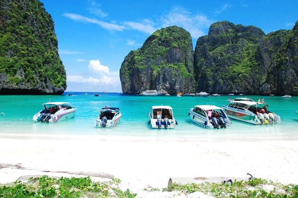 5 boats anchored at maya bay in the Phi Phi Islands