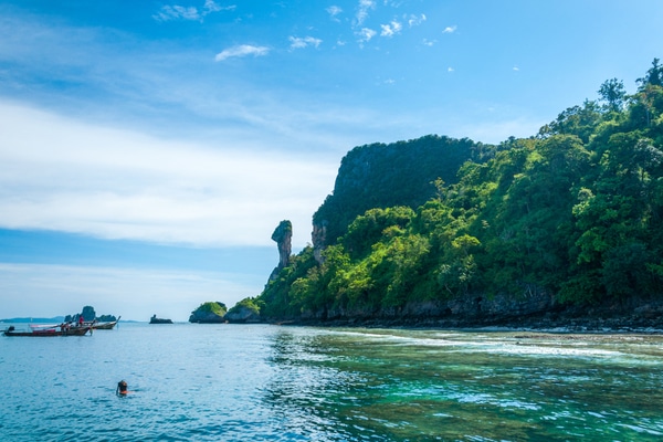 chicken island as seen from the Eastern side with swimmers bathing in the waters