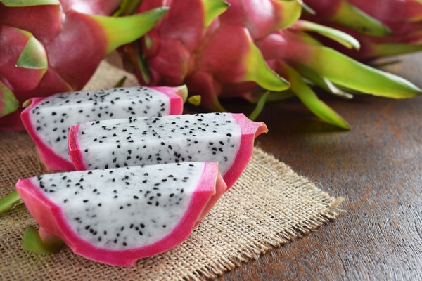 a dragon fruit sliced on a kitchen bench