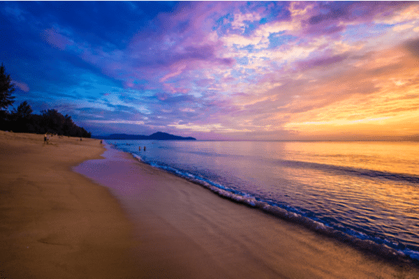 Mai Khao beach at sunset looking over the calm water