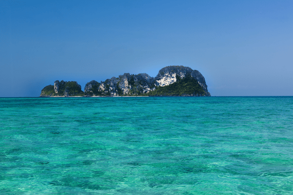 mosquito island as seen from a tour boat on approach